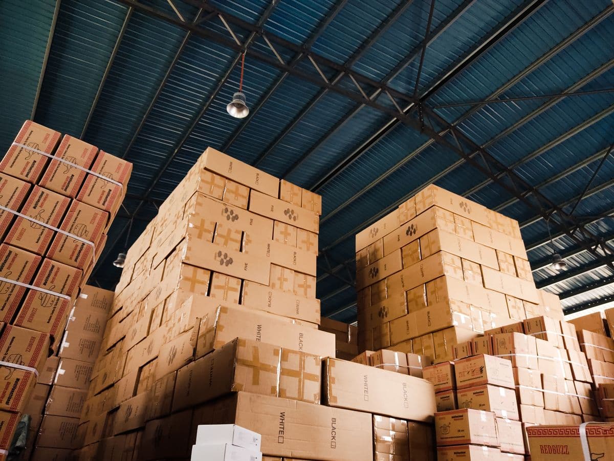 Strapped carton stacks stored in a warehouse logistics facility